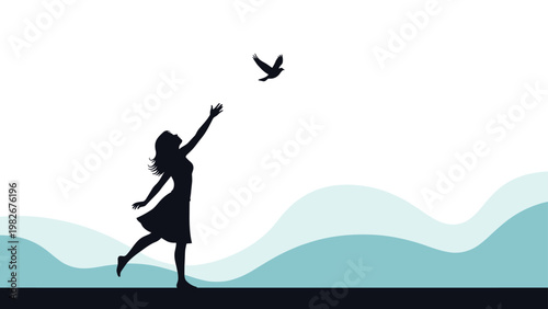 Silhouette of a woman standing on a beach and reaching her hand out toward a bird flying away over a wavy blue ocean.