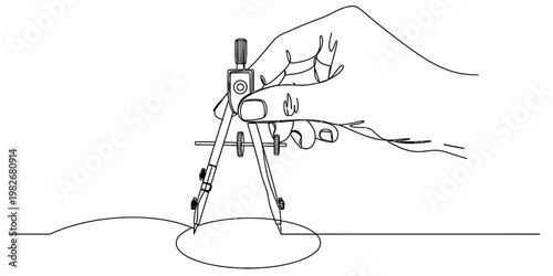 A hand holding a metal drafting compass to draw a perfect circle on a plain white paper surface