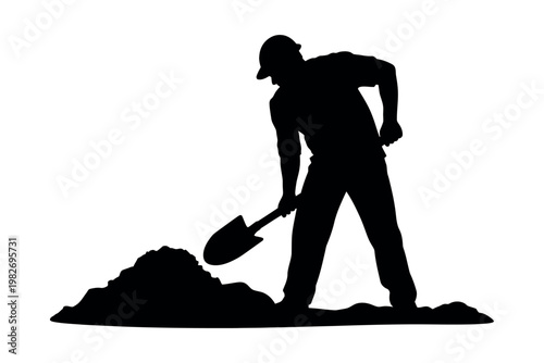 A silhouette of a man digging a hole with a shovel in a construction site