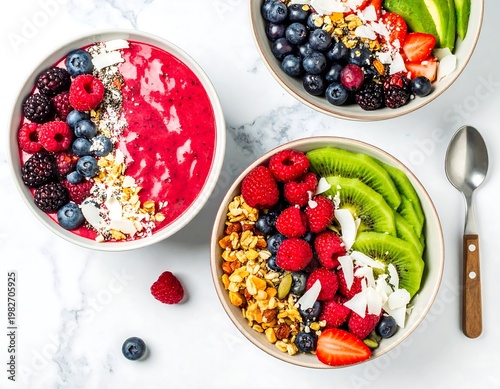 A vibrant and healthy breakfast spread featuring colorful fruit bowls on a marble countertop