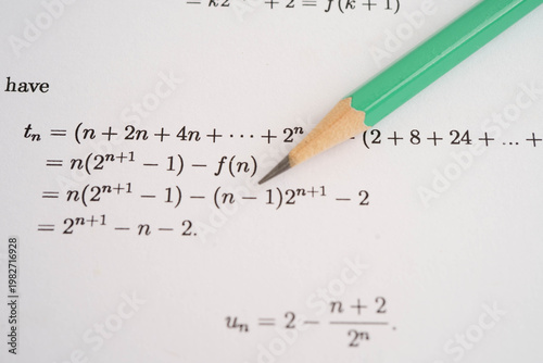 Pencil on mathematic formula exercise test paper in education school.