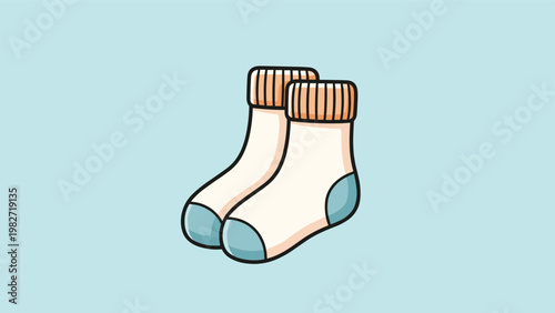 Pair of cozy beige socks with orange ribbed cuffs and light blue heels and toes is shown on a soft pastel blue background.