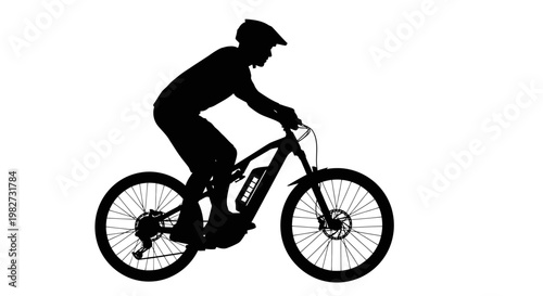Silhouette of a mountain biker riding an electric bicycle outdoors