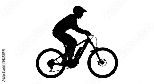 Silhouette of a cyclist riding an electric mountain bike outdoors