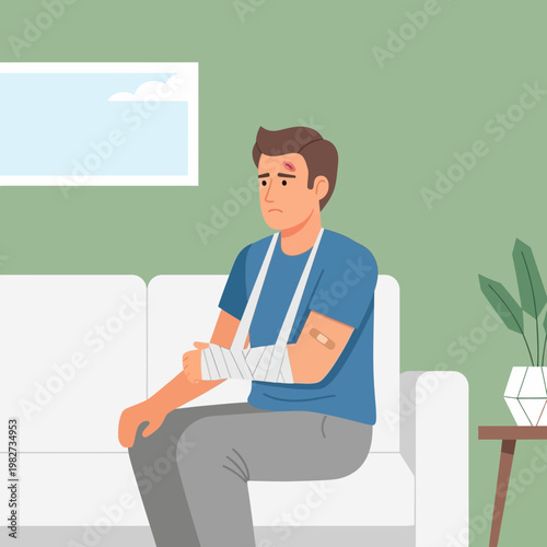 Man with broken arm and head injury sitting on sofa, recovering from accident