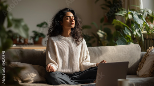 South Asian woman meditation in front of the laptop. Work Life Balance.