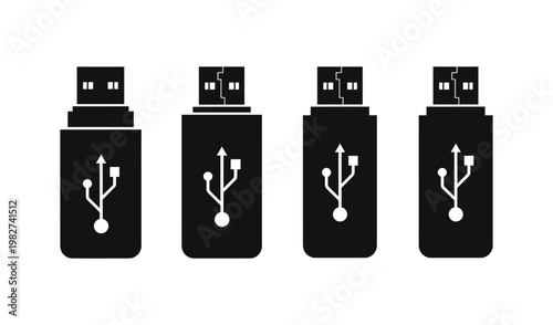 Four black USB flash drives with symbols, isolated on white background, showcasing digital storage solutions for technology and data transfer needs.