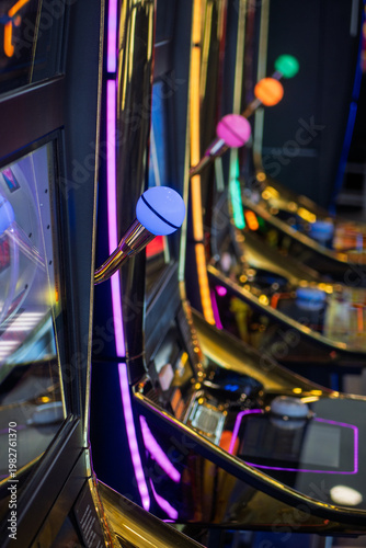 Row of bright slot machines in a casino