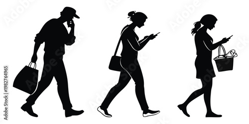 Silhouettes of people walking and using smartphones in a public space