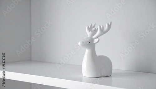 Minimalist White Ceramic Deer Figurine on a Shelf.