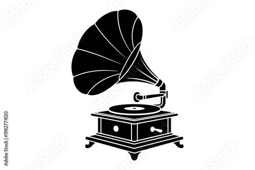 A vintage gramophone sitting on a table with a large horn-shaped speaker