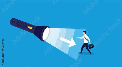 Powerful flashlight illuminates a clear path with a directional arrow for a businessman carrying a briefcase in a dark blue space.