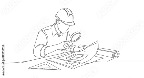 Man wearing hard hat examining architectural plans.