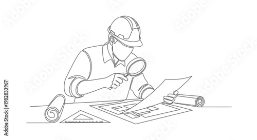 Man wearing a hard hat examining blueprints.