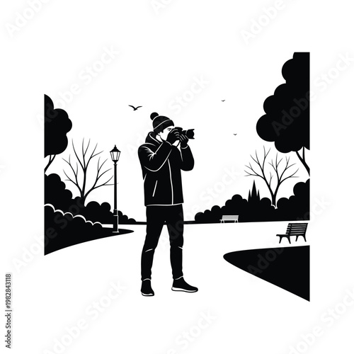 Photographer taking pictures in park, man with camera wearing winter hat and jacket, outdoor photography.