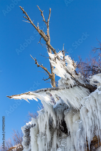 Large icicles hang from the steep cliffs.