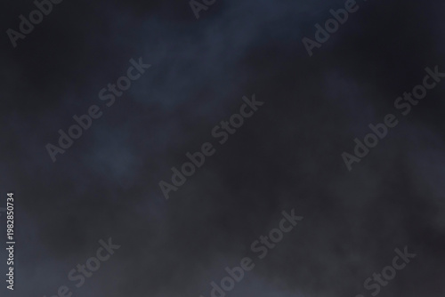 black smoke from the fire in a blue sky