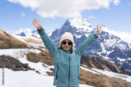 Child hiking in the Swiss Alps mountains during vacation, Grindelwald, First Cliff Walk