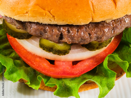 Juicy burger with fresh ingredients close up