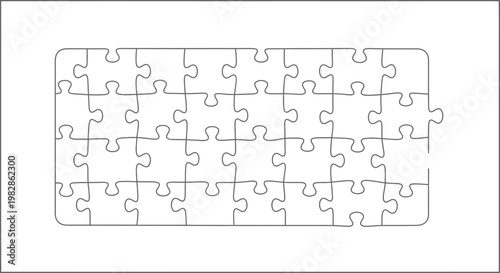 A puzzle with many pieces lies unsolved on a surface