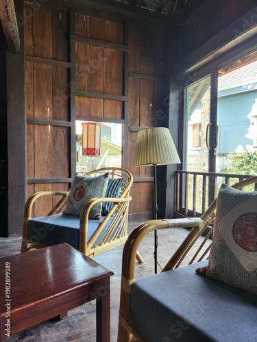 Cozy Wooden Interior with Rattan Armchairs and Natural Light