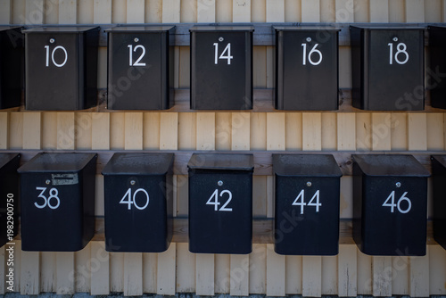 Akersberga, Sweden Numbered mailboxes in a residential parking lot.