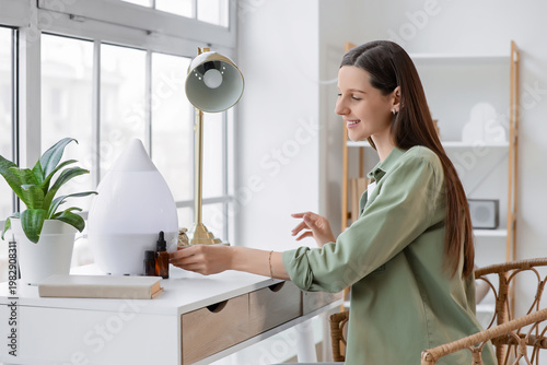 Young woman with air humidi...