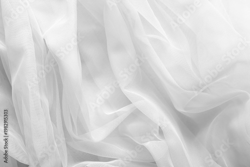 Foto White tulle fabric as background, top view