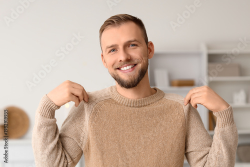 Young man in beige sweater ...