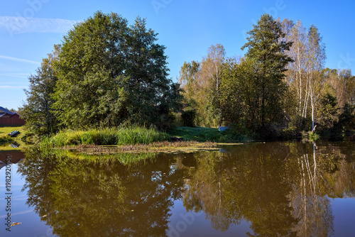 Tranquil River Reflections of Autumn Trees