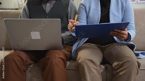 Businessmen team or financial data analysts working with tablets and laptop computers and data graphs together. Plan to analyzing projects in the office.