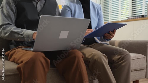 Teamwork process, Business team using a calculator to calculate the numbers of statistic business profits growth rate on documents graph data, desk in the office.