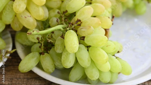 Fresh green grape or shine muscat grape fruit. Healthy eating. Fresh ripe grapes on wooden table, close up