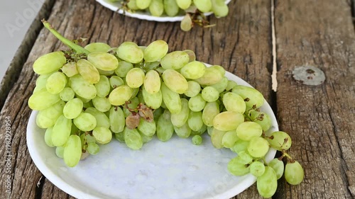 Fresh green grape or shine muscat grape fruit. Healthy eating. Fresh ripe grapes on wooden table, close up