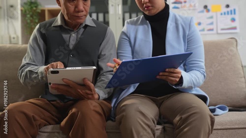 Teamwork process, Business team using a calculator to calculate the numbers of statistic business profits growth rate on documents graph data, desk in the office.