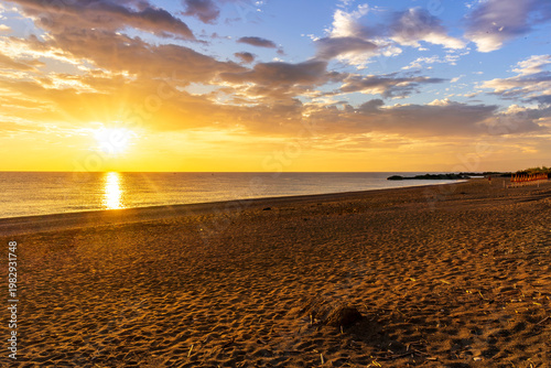 scenic beach landscape on a morning sea coast during beautiful sunrise with beautiful sea water and amazing cloudy sky on background. sunset beach ocean panorama