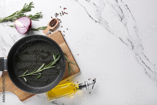 Frying pan with oil and ros...
