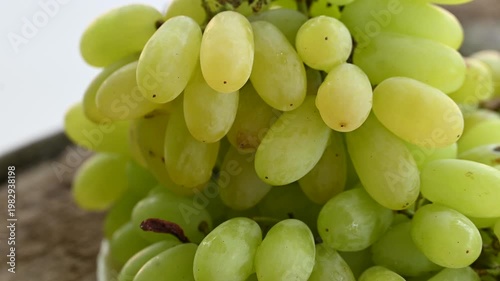 Fresh green grape or shine muscat grape fruit. Healthy eating. Fresh ripe grapes on wooden table, close up