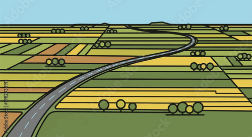 Winding road through colorful agricultural fields under a clear blue sky