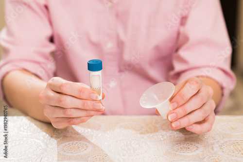 Fotografie Collecting saliva for DNA test in a home setting