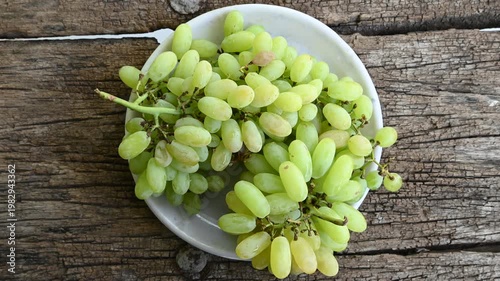 Fresh green grape or shine muscat grape fruit. Healthy eating. Fresh ripe grapes on wooden table, close up