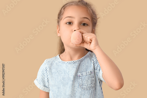 Cute little girl with makeu...