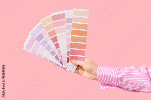 Female hand with color pale...
