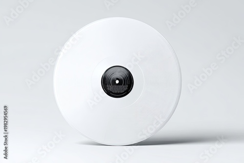 Minimalist shot of a white vinyl record against a clean white backdrop