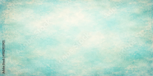 Beautiful abstract grunge blue background with fluffy white clouds in a bright summer sky atmosphere offering plenty of copy space for a clear nature texture