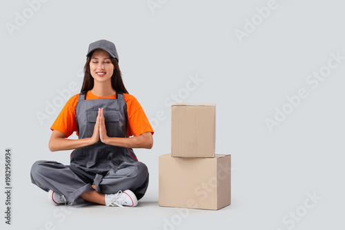 Female worker with cardboar...
