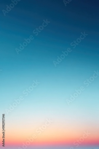 The sky displays a smooth gradient from deep blue at the top to soft light at the horizon. This scene captures the beauty of an early morning transition
