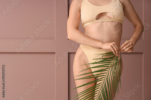 Young woman in stylish swim...