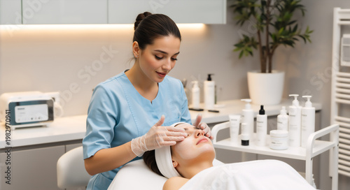 Esthetician applying a facial mask to a client in a beauty spa. Professional skincare treatment in a cosmetology clinic