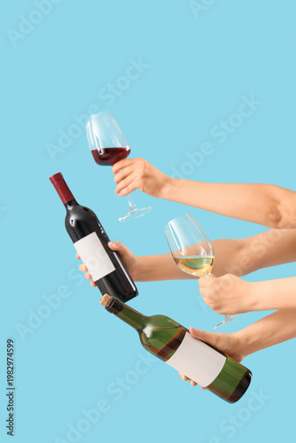 Female hands holding glasse...